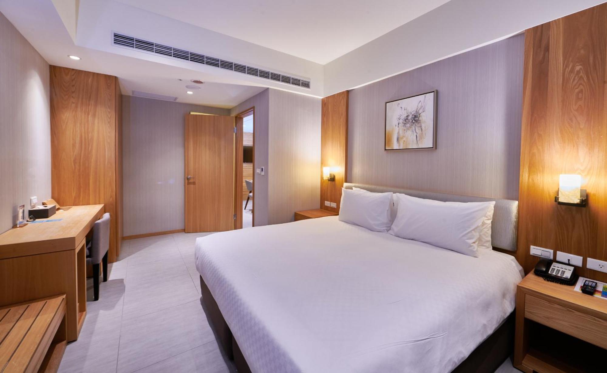 แกรนด์ เบย์ รีสอร์ต Hotel ย่านเมืองเก่าเฮ้งชุน ภายนอก รูปภาพ A bedroom at the hotel